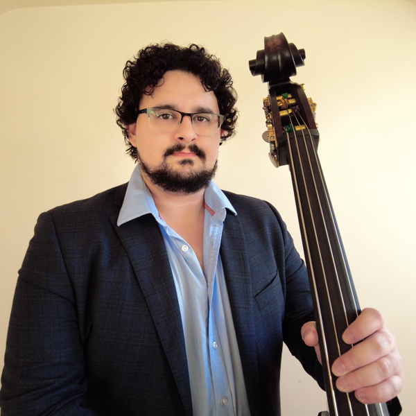 Chris Xuereb holding a double bass