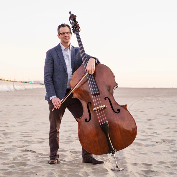 Scott Pingel holding a double bass