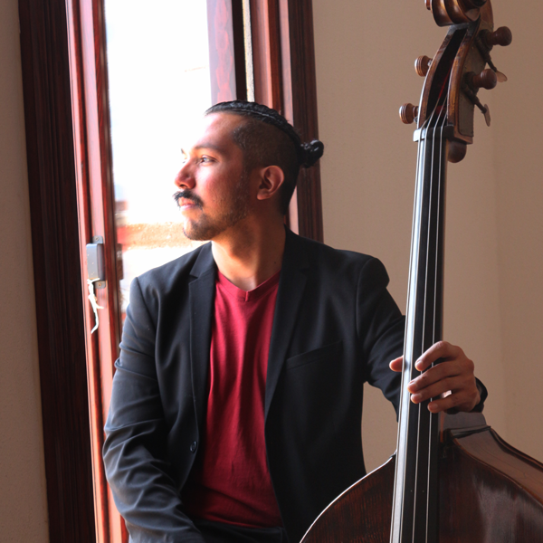 Rodrigo Mata holding a double bass