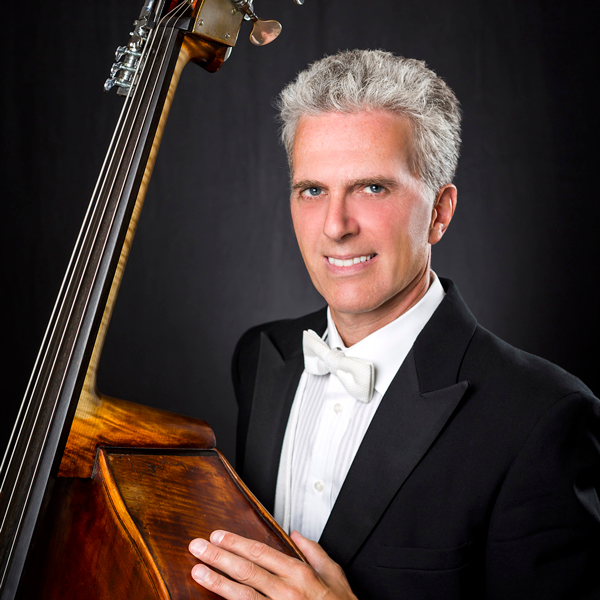 Tim Cobb holding a double bass
