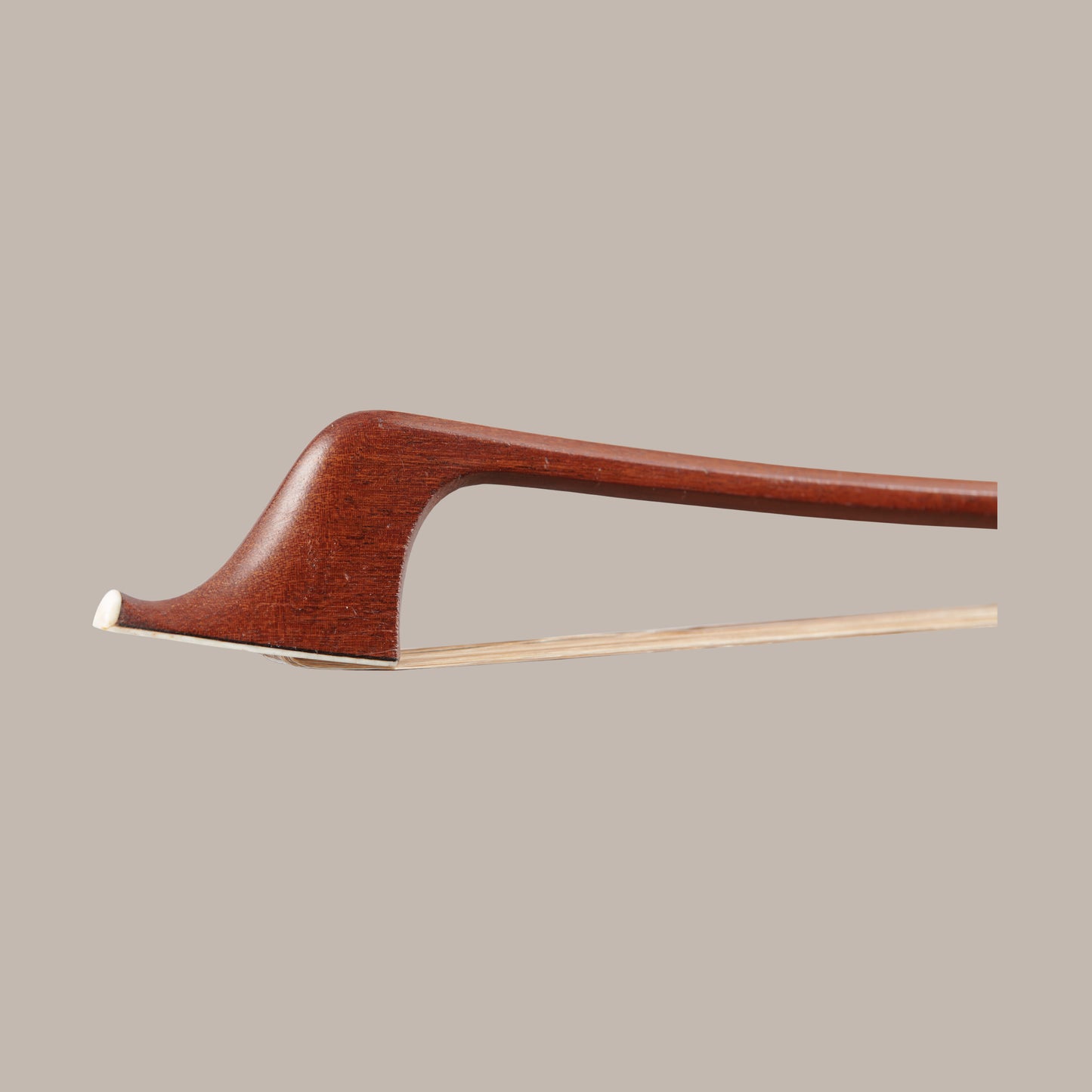 L.  Morizot c.1950 Double Bass Bow - Head showing the tip of the bow on a beige background