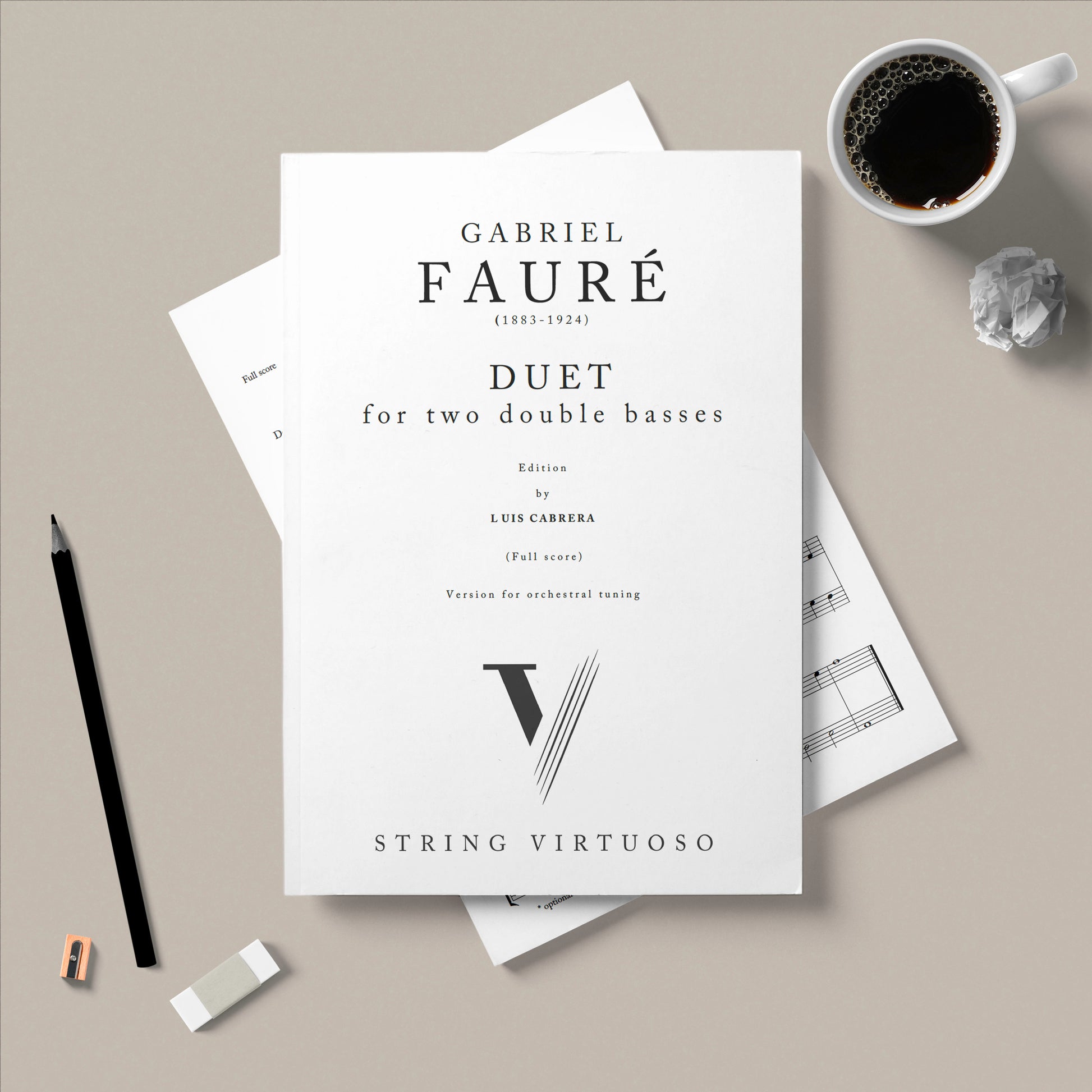 Music sheet for Gabriel Faure's 'Duet' with a cup of coffee and pencil on a gray surface