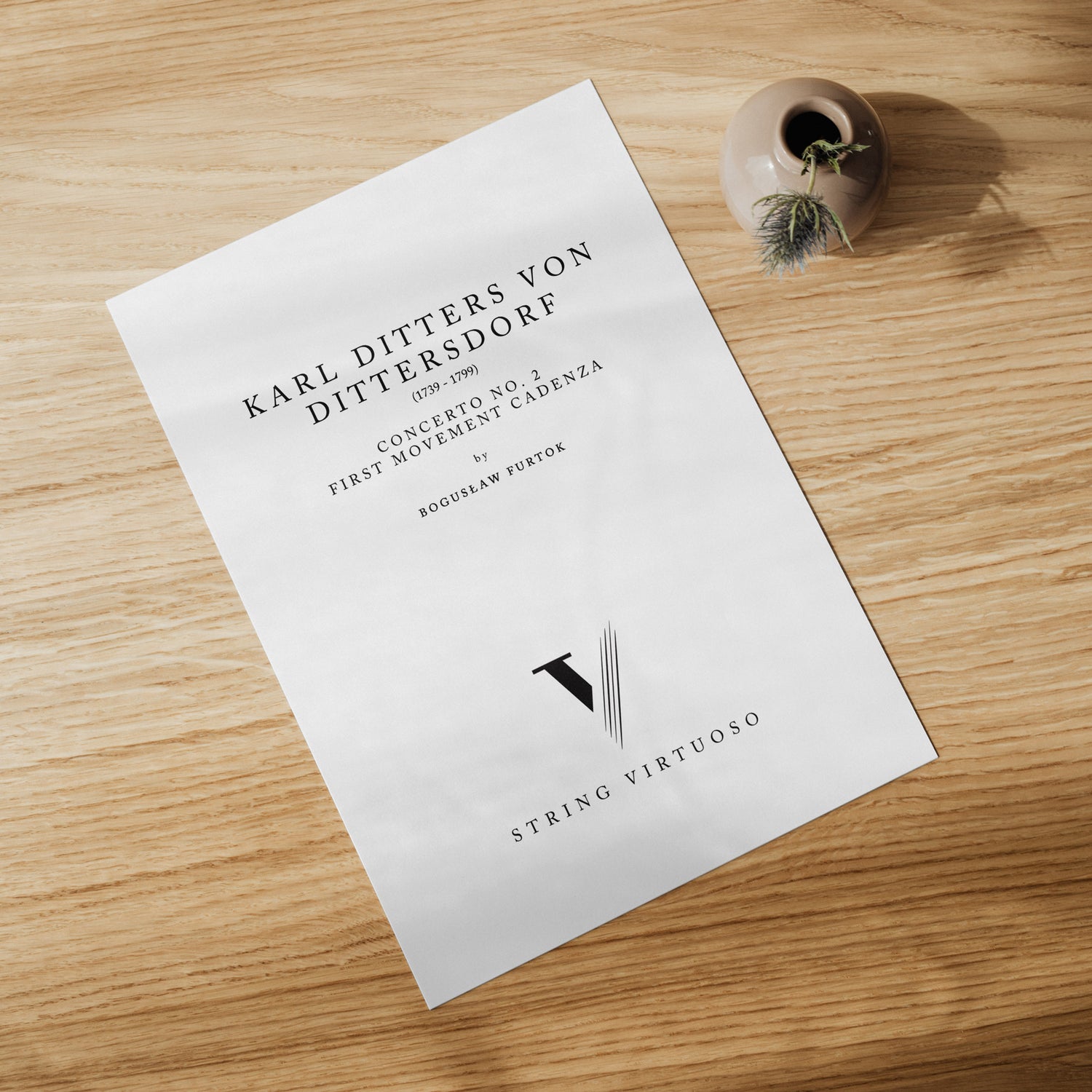 A PDF sheet music titled 'Dittersdorf Concerto' for double bass by Boguslaw Furtok. The sheet music is placed on a wooden surface with a decorative item to the side.